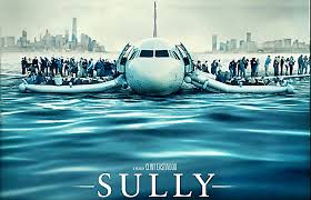 "A dramatic close-up of Tom Hanks as Captain Chesley 'Sully' Sullenberger, wearing a pilot's uniform, looking determined with an airport runway and emergency vehicles blurred in the background. The poster highlights the intense true story of the 'Miracle on the Hudson.'"