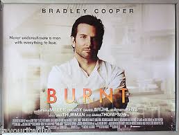 "A promotional poster for the 2015 film 'Burnt,' starring Bradley Cooper as a troubled chef in a white kitchen uniform, holding a chef’s knife. The background features a blurred gourmet dish, emphasizing themes of redemption and culinary excellence."