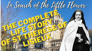 "Young Thérèse Martin in a Carmelite habit, her face softly illuminated by candlelight as she holds a simple wooden cross. A shower of rose petals falls around her against the backdrop of a stone convent."