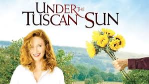 "Diane Lane smiles in a sunlit Tuscan field, surrounded by golden hills and cypress trees. Movie poster for 'Under the Tuscan Sun' featuring a vibrant Italian villa and warm sunset tones." Detailed Alt Text (Accessibility-Focused):