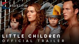 *"A suburban street at golden hour, where Sarah (Kate Winslet) in a blue sundress walks hand-in-hand with Brad (Patrick Wilson) while children's toys lie abandoned on the lawn. The title appears in childlike crayon font, contrasting with the film's adult themes of desire and repression."