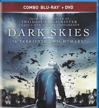 *"A tense sci-fi horror poster for 'Dark Skies' (2013) featuring a suburban family at night, their faces illuminated by an eerie blue light as shadowy figures loom in the background, suggesting an alien invasion."*