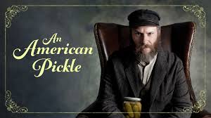 *"Seth Rogen stars as Herschel Greenbaum, a 1920s immigrant, and his modern-day descendant Ben Greenbaum in a split-screen scene from the comedy film An American Pickle. Herschel wears old-fashioned clothing and a bushy beard, while Ben appears in casual modern attire, highlighting the humorous contrast between the two characters."*