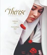 "Thérèse (Micaela Ramazzotti) in a Carmelite habit kneels before a crucifix, her face illuminated by candlelight as she clutches a handful of rose petals—symbolizing her ‘shower of roses’ promise."